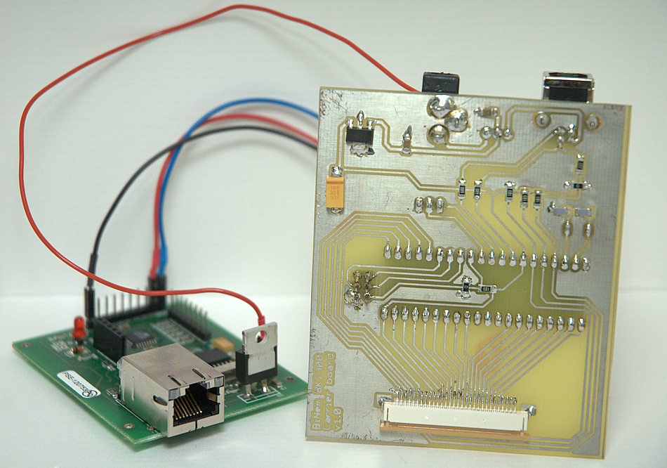 Under the carrier board. Under the carrier board.